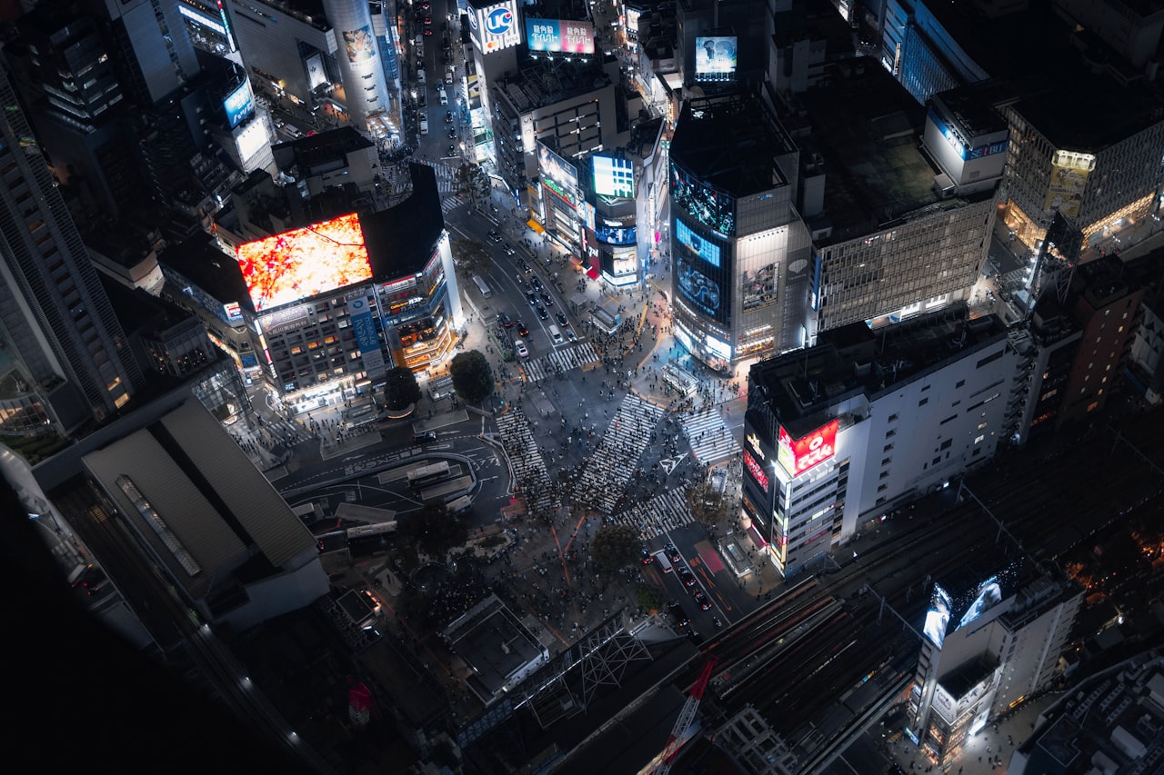 Aerial view of a busy city intersection at night