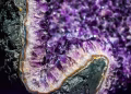 Detailed view of a stunning amethyst geode showcasing vibrant purple hues and intricate crystal formations.