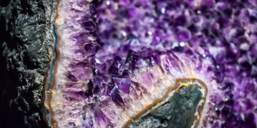 Detailed view of a stunning amethyst geode showcasing vibrant purple hues and intricate crystal formations.