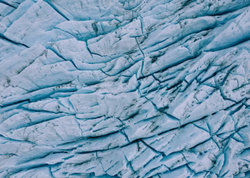 Detailed aerial shot of the stunning cracked surface of Perito Moreno Glacier in Argentina.