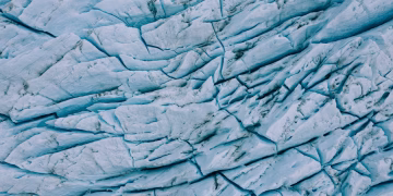 Detailed aerial shot of the stunning cracked surface of Perito Moreno Glacier in Argentina.