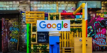google logo beside building near painted walls at daytime