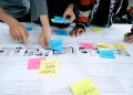team collaborating with sticky notes