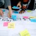 team collaborating with sticky notes
