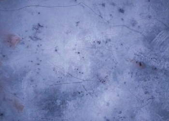 Textured frozen lake surface captured from above during winter in Weaver, Minnesota.