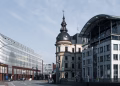 Explore Hamburg's cityscape with a blend of historic and modern architecture under a bright sky.