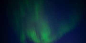 Stunning Aurora Borealis illuminating the night sky in Karasjok, Norway.