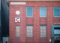 Historic red brick building with telecom signage in Hawthorn, Victoria, Australia.