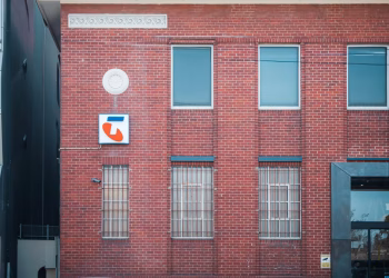 Historic red brick building with telecom signage in Hawthorn, Victoria, Australia.