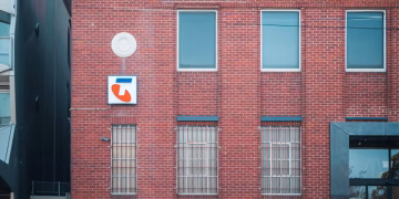 Historic red brick building with telecom signage in Hawthorn, Victoria, Australia.