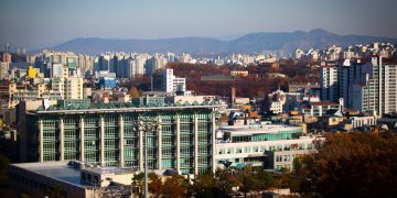 high-rise buildings beside trees