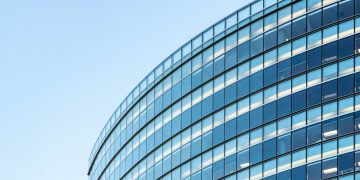white and blue glass walled building