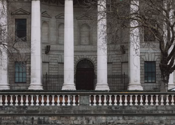 Elegant neoclassical facade of Dublin's Four Courts with iconic white columns.