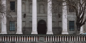 Elegant neoclassical facade of Dublin's Four Courts with iconic white columns.