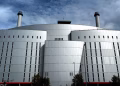 Front view of a modern industrial building with chimneys in Rotterdam.