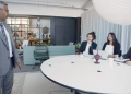Professional business meeting with executives in a modern conference room