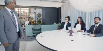 Professional business meeting with executives in a modern conference room