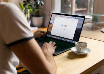 person using black laptop computer