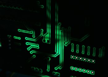 a close up of a computer motherboard in the dark