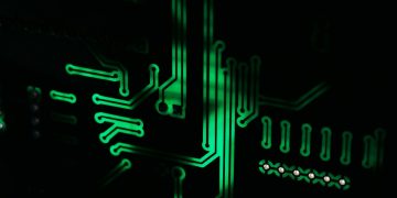 a close up of a computer motherboard in the dark