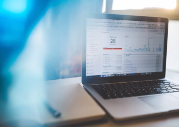 Laptop displaying Google Analytics in a modern workspace, highlighting digital analytics and technology.