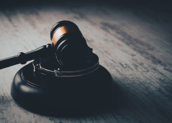 a judge's gaven on a wooden table