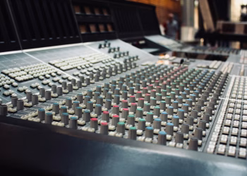 Close-up of a professional audio mixing console in a recording studio in Ciudad de México, Mexico.