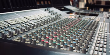 Close-up of a professional audio mixing console in a recording studio in Ciudad de México, Mexico.