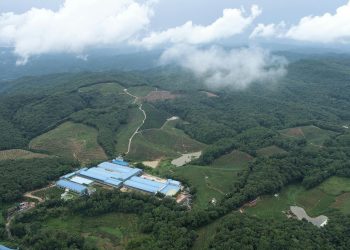 A stunning aerial view of lush fields and forests in Xishuangbanna, Yunnan, China.