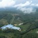 A stunning aerial view of lush fields and forests in Xishuangbanna, Yunnan, China.