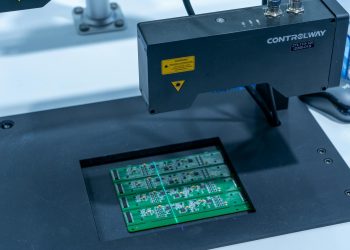 Close-up of a PCB inspection machine in action, highlighting technology.