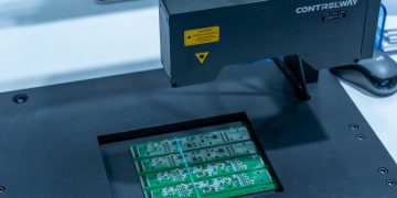 Close-up of a PCB inspection machine in action, highlighting technology.