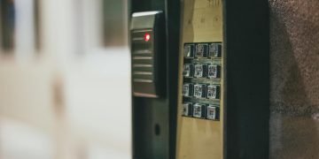 Close-up of a security access control keypad with illuminated buttons for keyless entry.