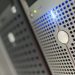 Focused detail of a modern server rack with blue LED indicators in a data center.