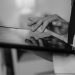 Close-up of a doctor's hand using a touchscreen tablet, highlighting digital healthcare technology.