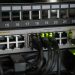Networking equipment with connected cables, showcasing modern technology infrastructure.