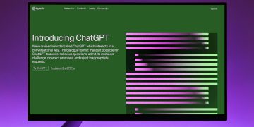 OpenAI Website with Introduction to ChatGPT on Computer Monitor