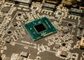 Detailed view of a microchip on a printed circuit board, showcasing electronic components.