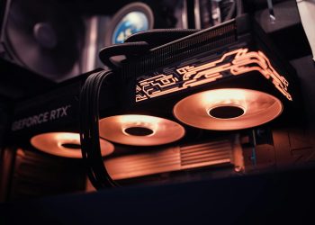 Detailed image of a GeForce RTX GPU with glowing LED lights inside a computer case.