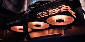 Detailed image of a GeForce RTX GPU with glowing LED lights inside a computer case.