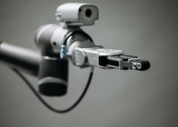 Close-up of a robotic arm showcasing advanced technology and innovation in an indoor environment.