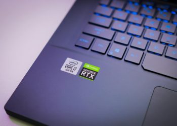 Laptop keyboard with Intel Core i7 and NVIDIA GeForce RTX stickers, symbolizing high-performance computing power.
