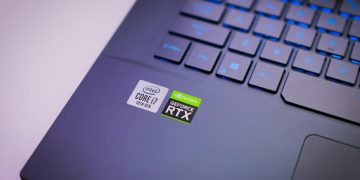 Laptop keyboard with Intel Core i7 and NVIDIA GeForce RTX stickers, symbolizing high-performance computing power.