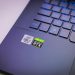 Laptop keyboard with Intel Core i7 and NVIDIA GeForce RTX stickers, symbolizing high-performance computing power.