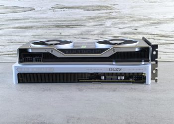 Two modern graphics cards stacked on a wooden surface, showcasing sleek design and advanced technology.
