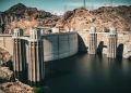 A majestic view of Hoover Dam against a desert landscape, showcasing American engineering