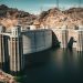 A majestic view of Hoover Dam against a desert landscape, showcasing American engineering
