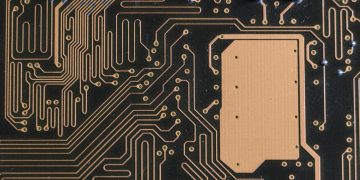 Detailed view of intricate circuit board patterns in technology hardware.