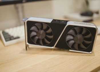 Close-up of a GeForce RTX graphics card on a desk, showcasing its design and technology.