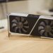 Close-up of a GeForce RTX graphics card on a desk, showcasing its design and technology.